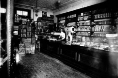 Annie-Neate-behind-the-counter-at-Neates-New-Edinburgh-Grocery-located-on-Sussex-Drive-behind-the-No.-6-Fire-Station-The-grocery-housed-the-post-office-during-the-1920s